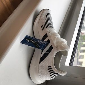 Brand new. Size 7 adidas - swift run women